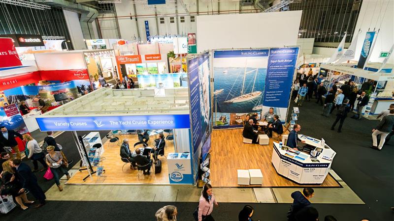 Construction company booth at a trade show featuring branded displays and interactive exhibits