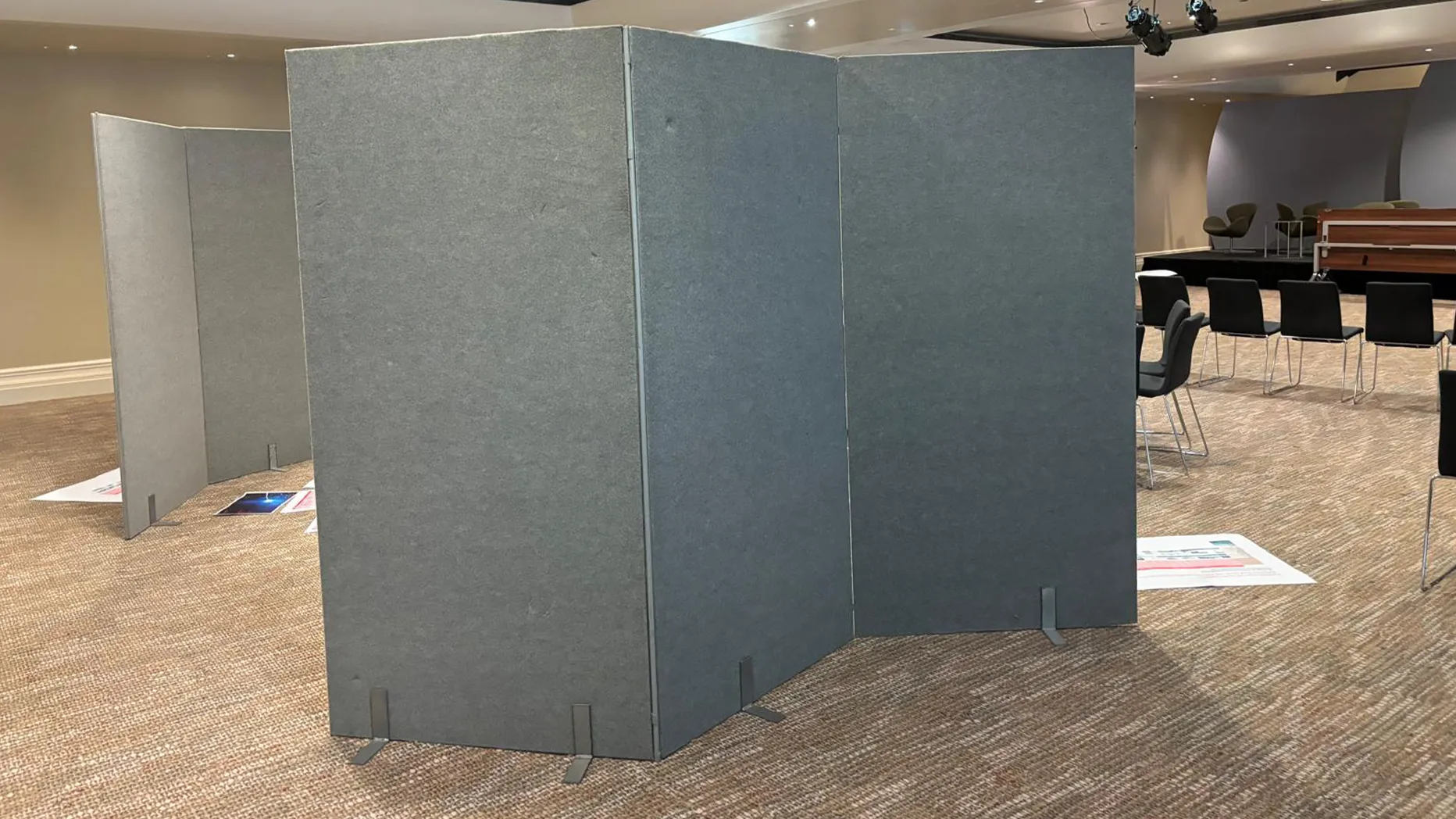 A professional and stylish portable exhibition stand at a busy trade show.